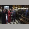 Trump listening to clergy in red robes