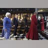 Trump and Melania walking with guides