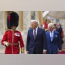US President Donald Trump and King Charles III walk to inspect the Guard of Honour during the ceremonial welcome at Windsor Castle.