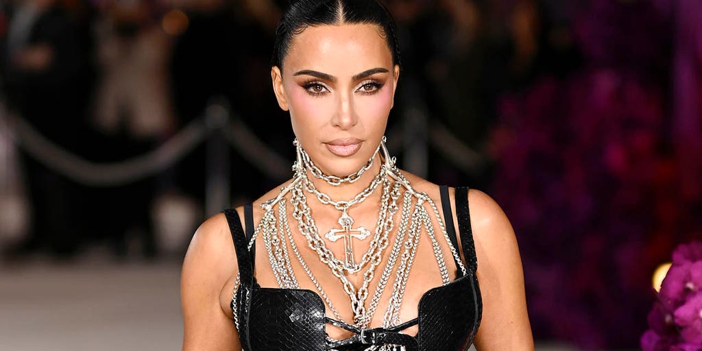 Kim Kardashian ditches face mask for sheer braided dress at exclusive London after-party