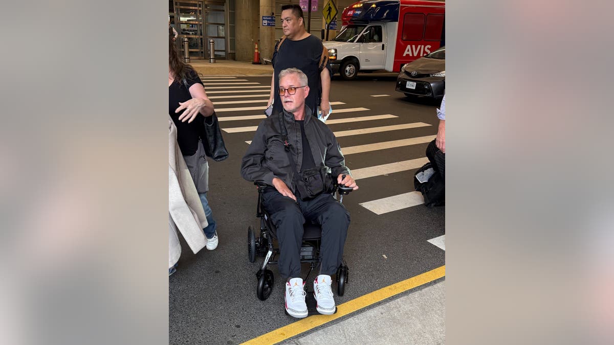 Eric Dane in a wheelchair