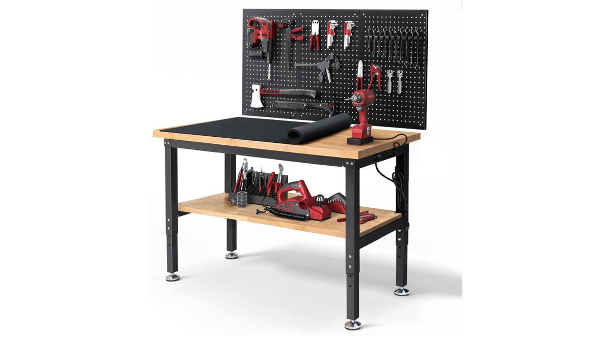 Stay organized with this work table, complete with a peg board and cord organizer. 