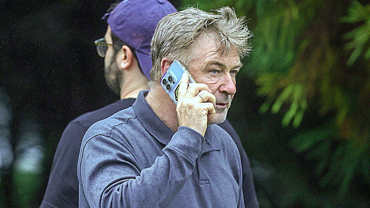 Alec Baldwin uses cell phone after car crash