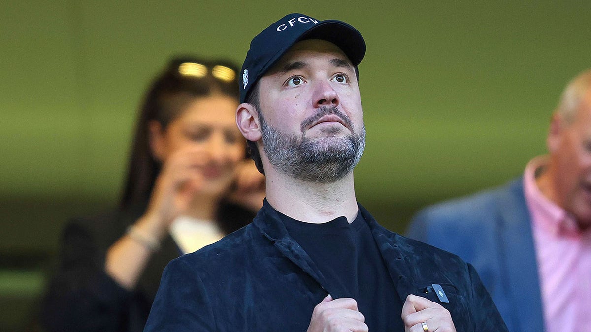 Alexis Ohanian looks on