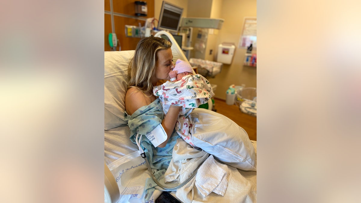 Amber Smith holding her son at the hospital.