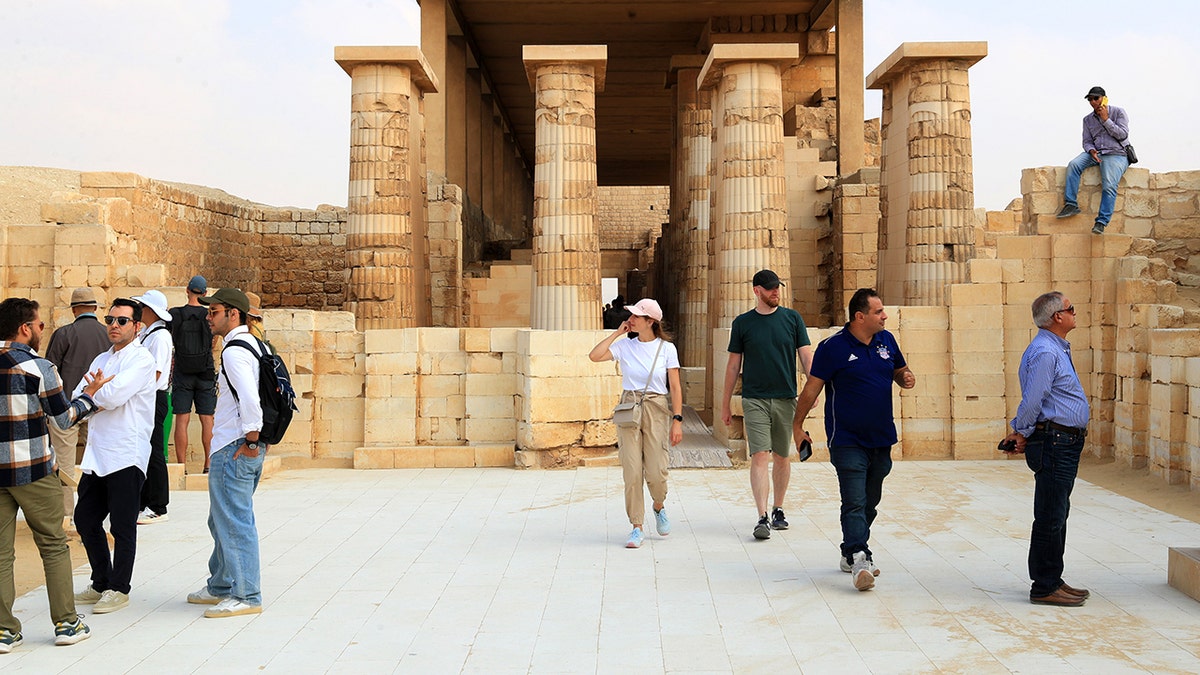 Tourists standing and looking at necropolis