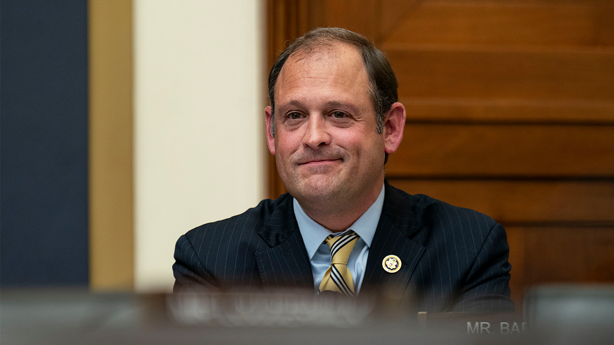 Rep. Andy Barr smiles during a House hearing