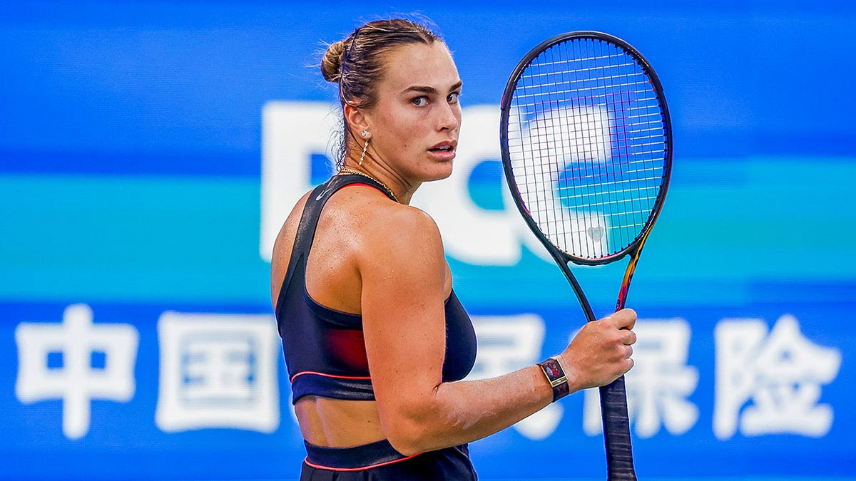Aryna Sabalenka looks on court