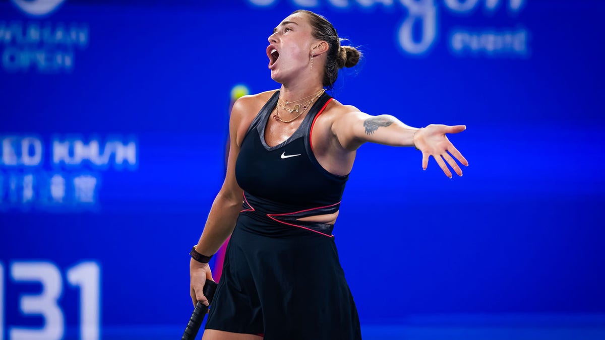 Aryna Sabalenka argues on court
