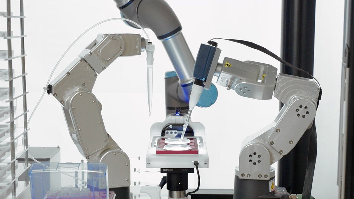 AURA AI powered robot manipulate an IVF dish