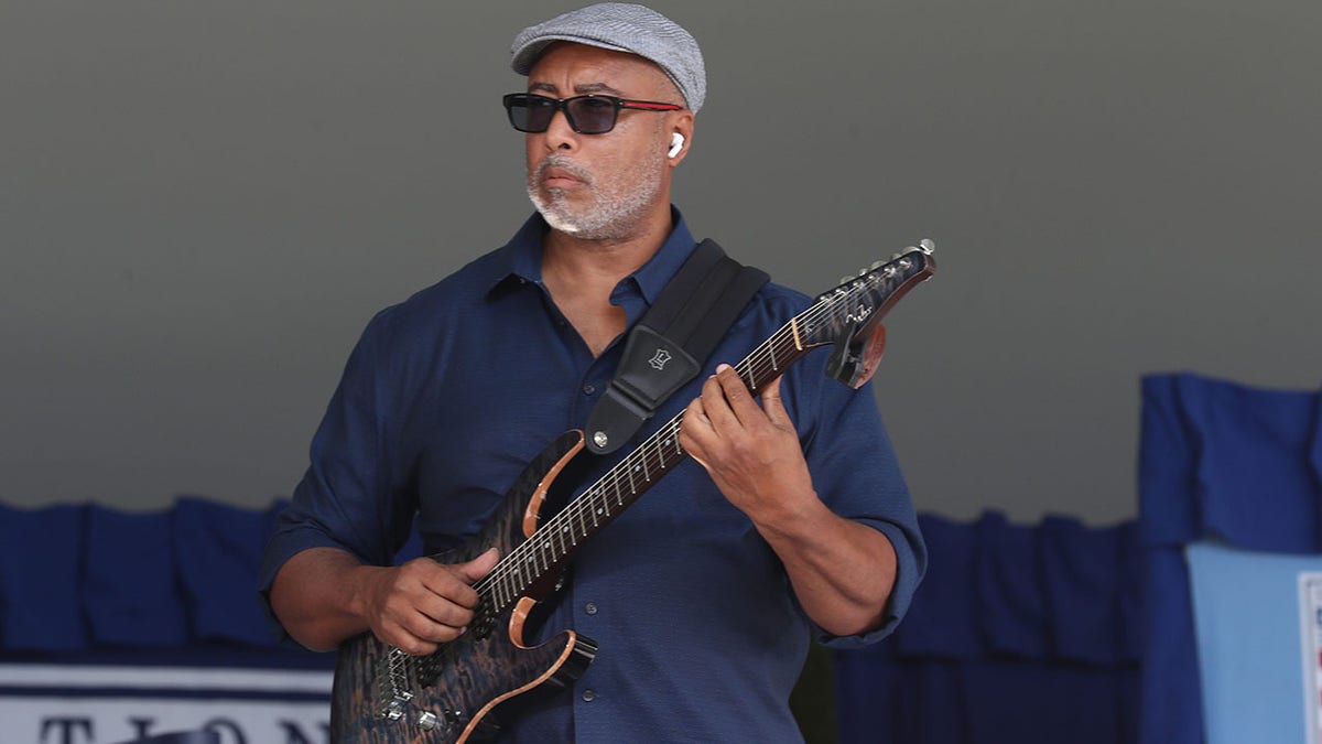 Bernie Williams playing guitar