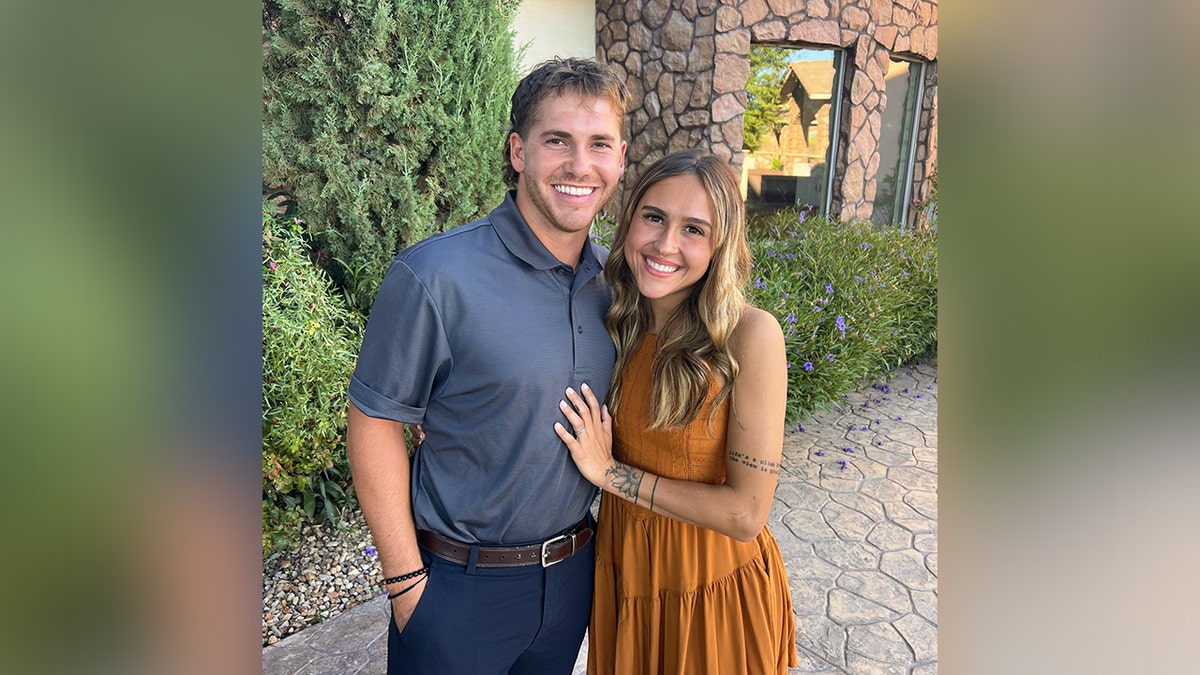 Kasydee and Hunter Bishop smile outdoors