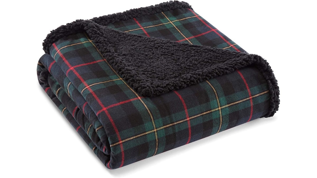 Keep your loved ones warm with this plaid Eddie Bauer blanket. 