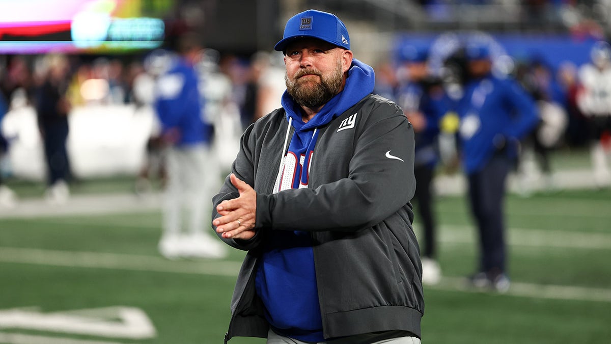 Brian Daboll walks off after a game