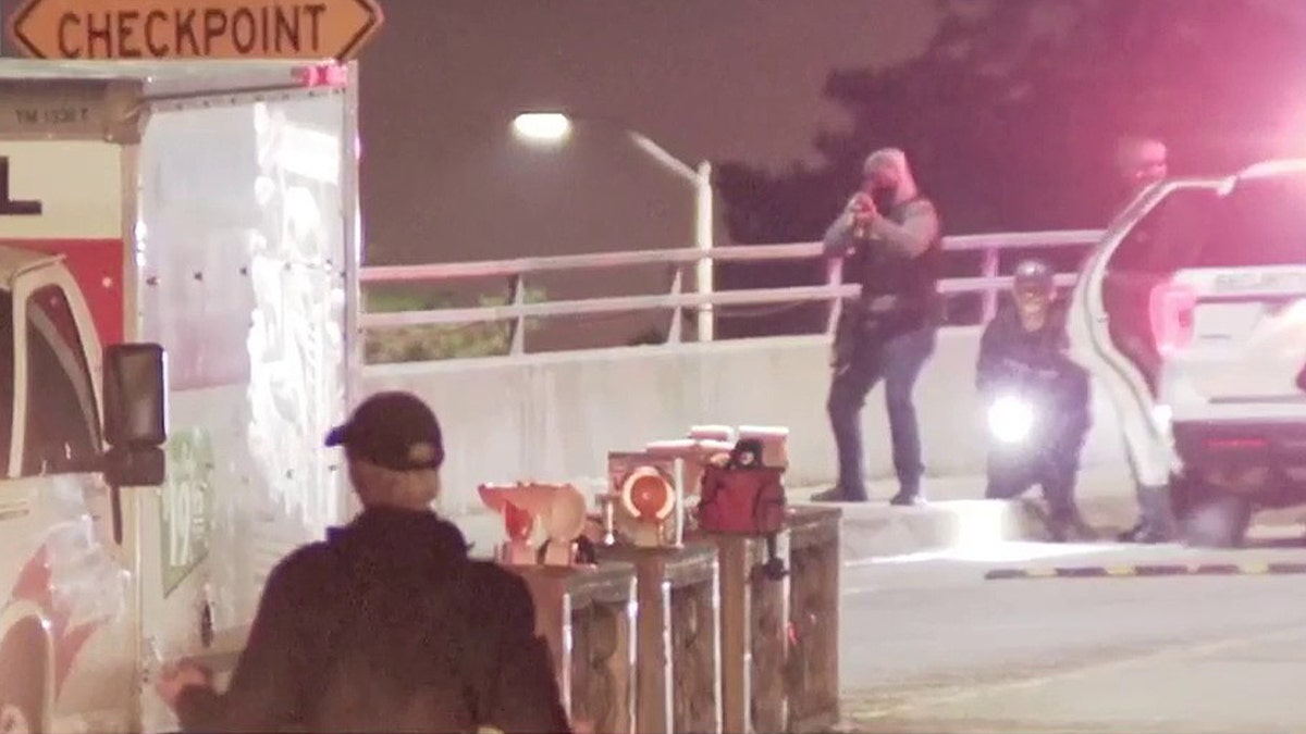 Security firing gunshots at U-Haul approaching entrance