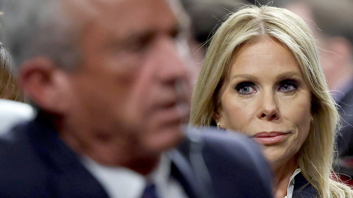 Cheryl Hines watches her husband Robert F. Kennedy, Jr. during a Senate committee hearing