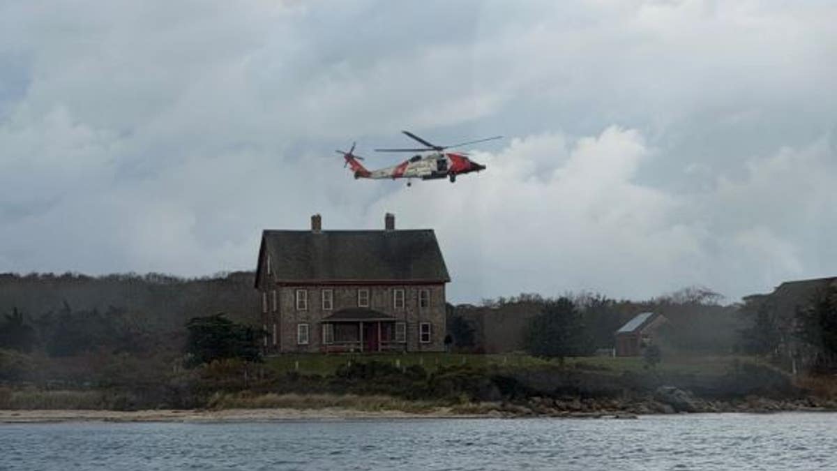 Helicopter flying away from island
