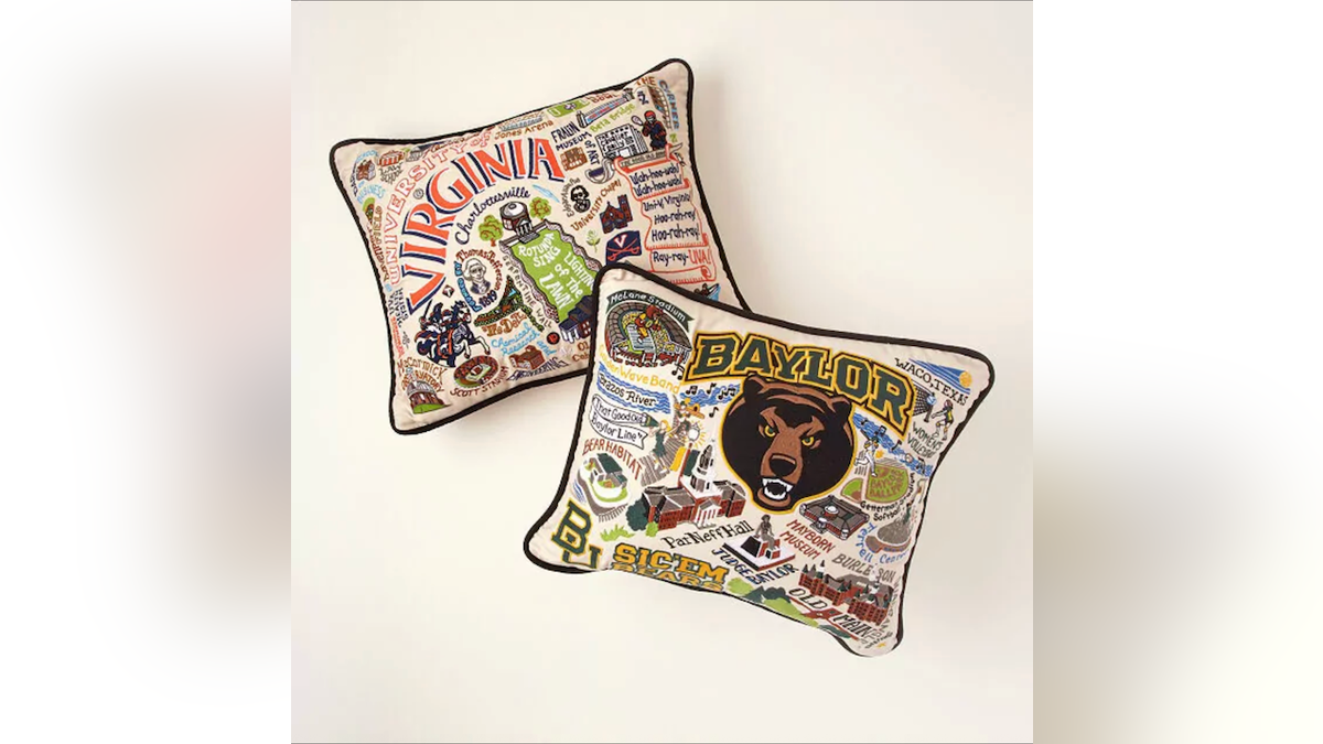 Give them a pillow embroidered with traditions and icons from their alma mater.