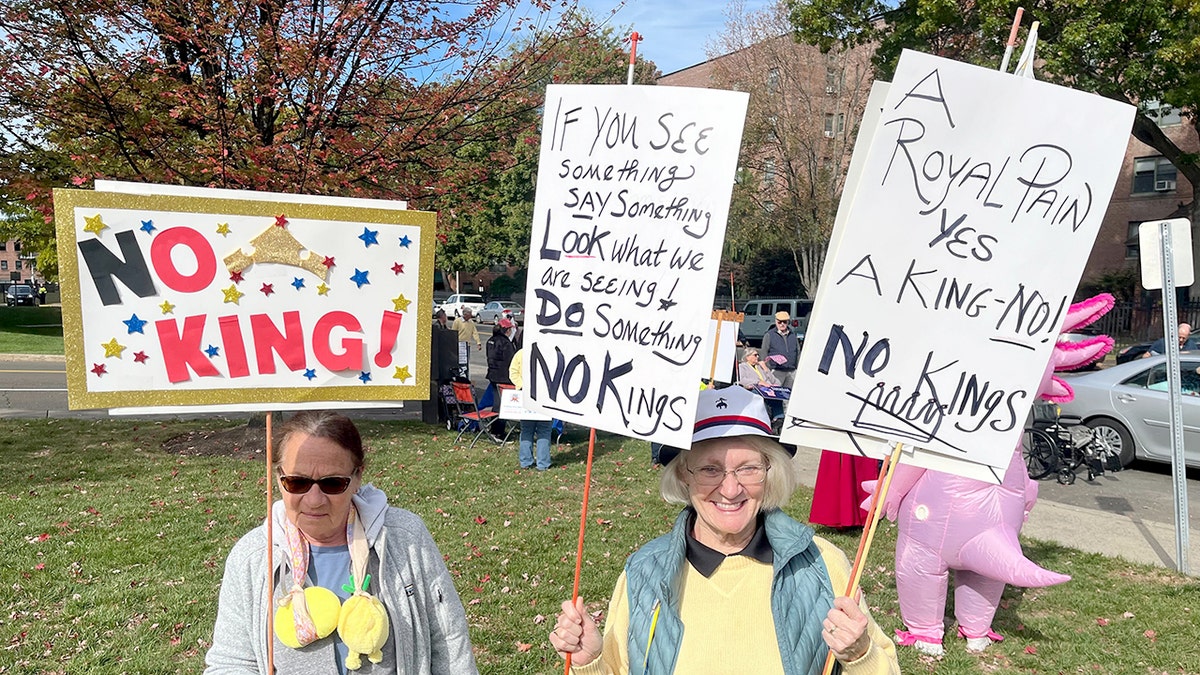 Protesters hold signs about Connecticut "There are no kings" ancient