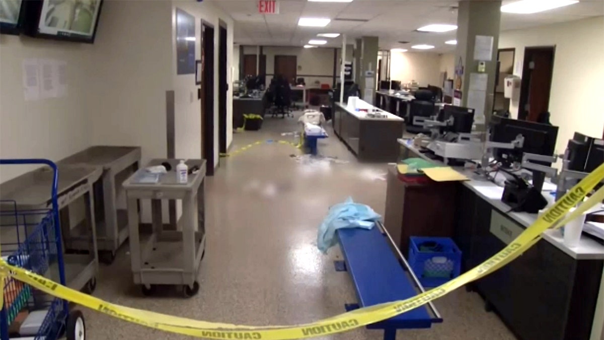 Interior of a Dallas ICE facility with caution tape