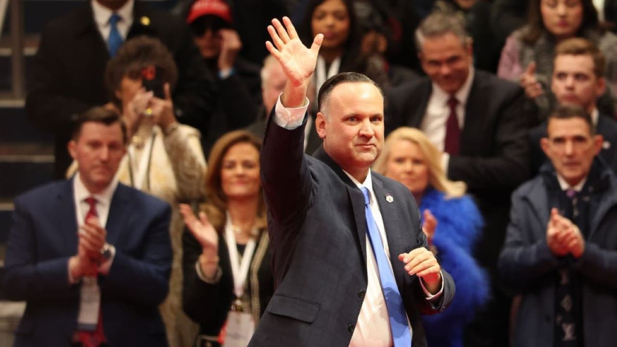 Dan Scavino waves to a crowd