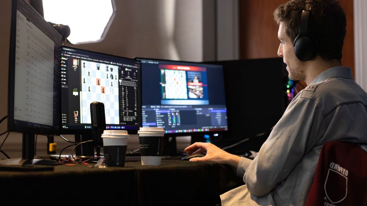 Daniel Naroditsky livestreams chess games at his computer; the American grandmaster has died at 29.