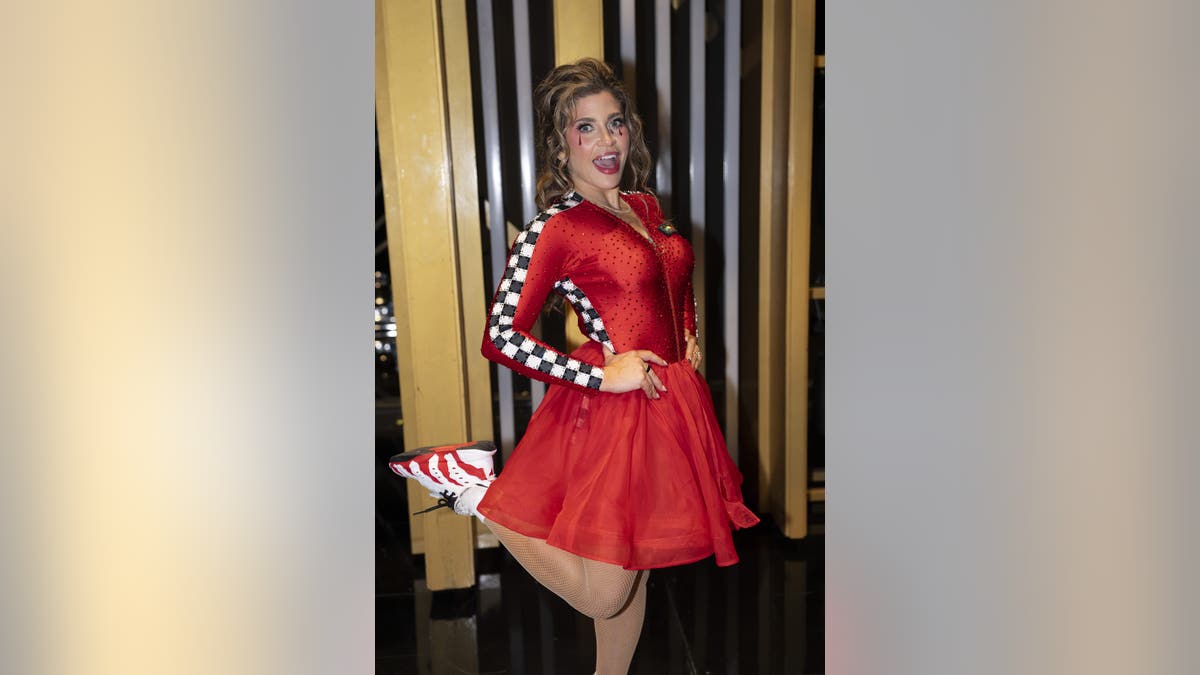 Danielle Fishel dressed in a red costume for