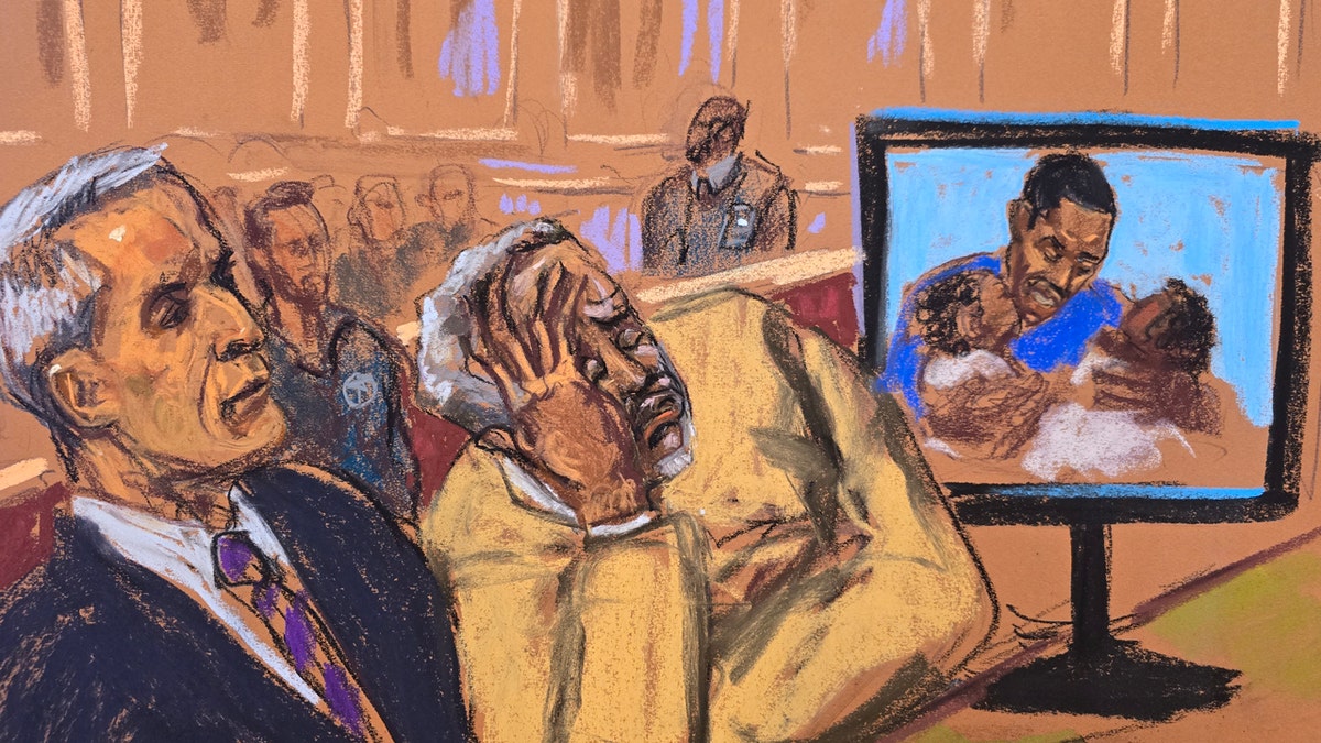 Sean "Diddy" Combs watches a video in court