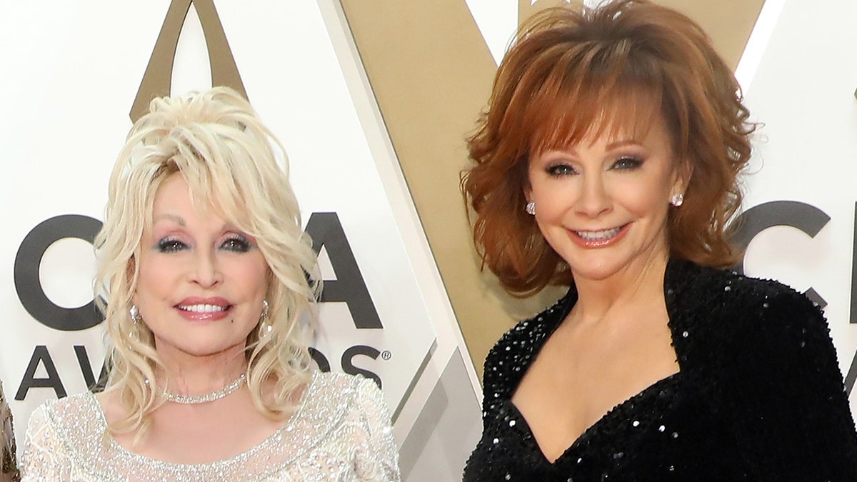 Dolly Parton and Reba McEntire on the red carpet at the CMA Awards in November 2019.