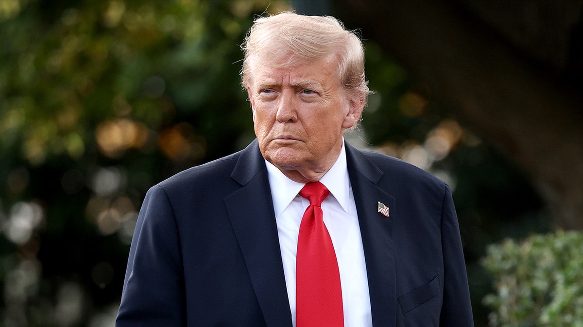 President Trump walking across White House lawn