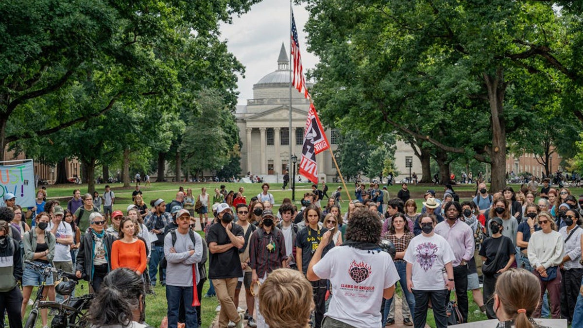 UNC professor Dwayne Dixon supporters rally on campus
