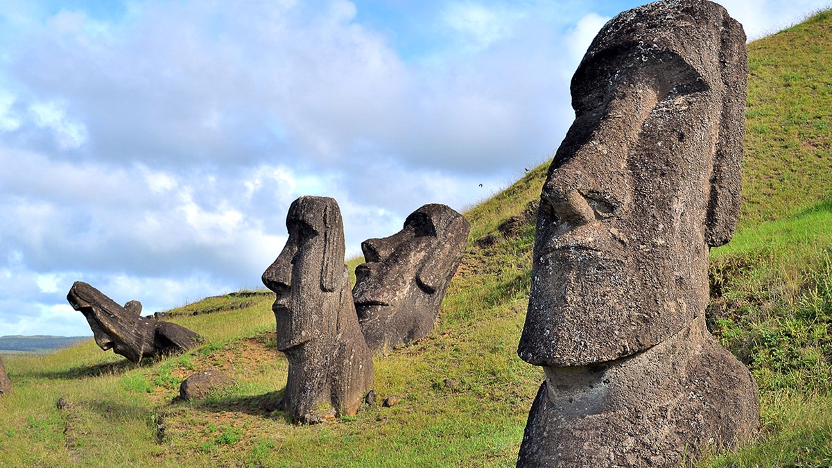 Close-up of easter island heads on mountain