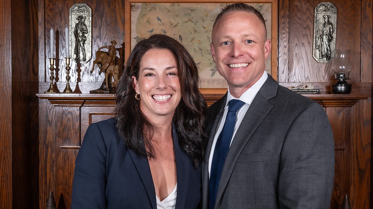 Emily Fertitta stands for a picture with her husband, Valentine Fertitta