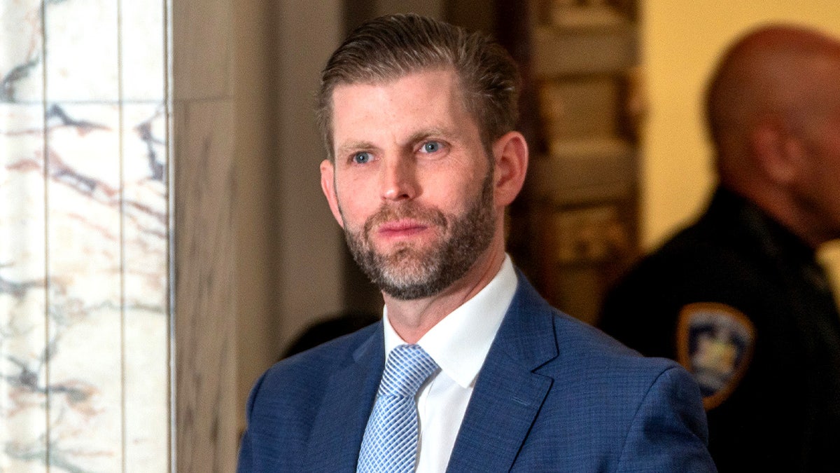Eric Trump leaving the courtroom during a lunch break during the civil fraud trial against his father