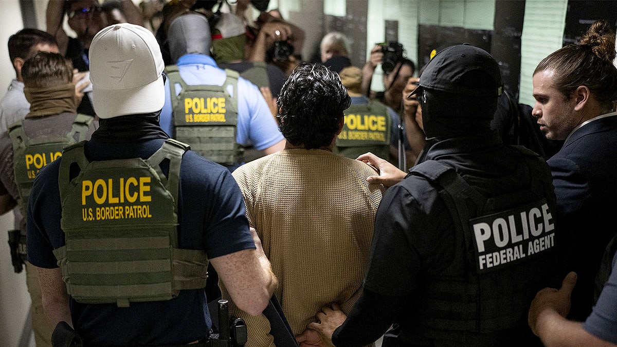 Federal agents apprehend a person after a court hearing