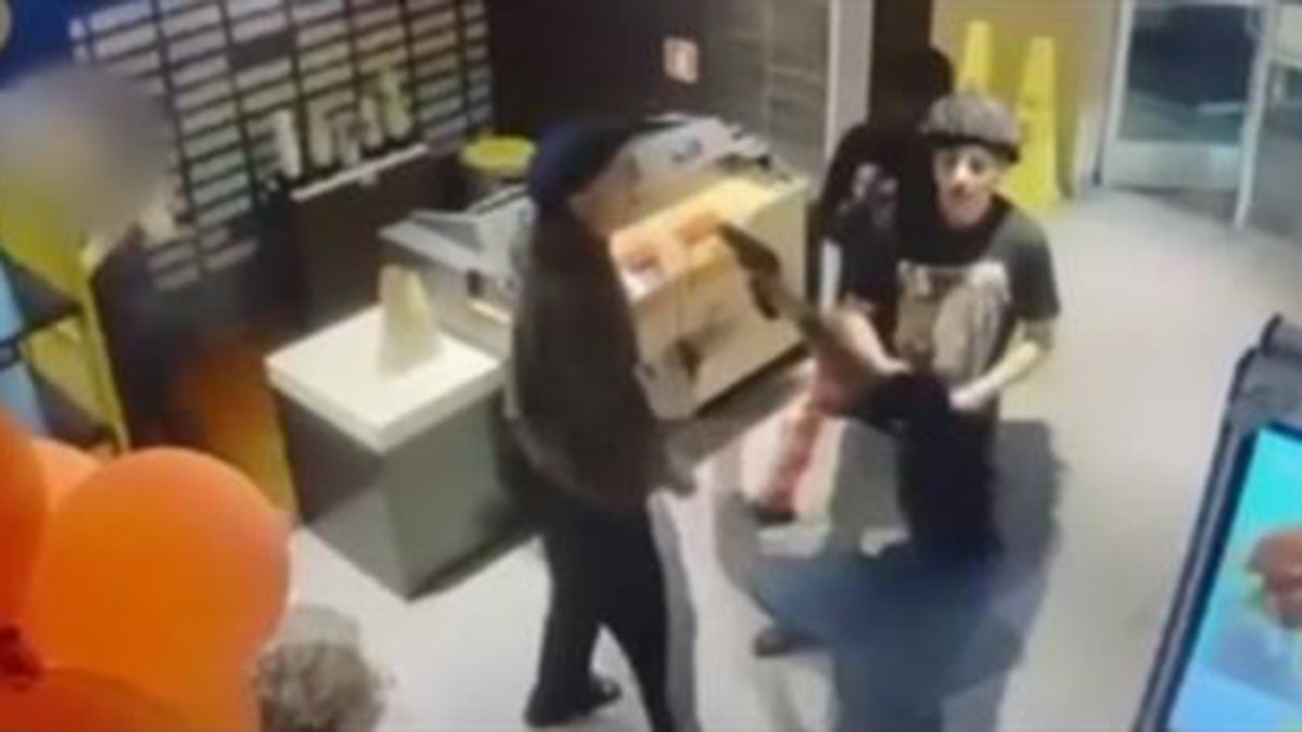 Survelliance footage of altercation and gun being pointed