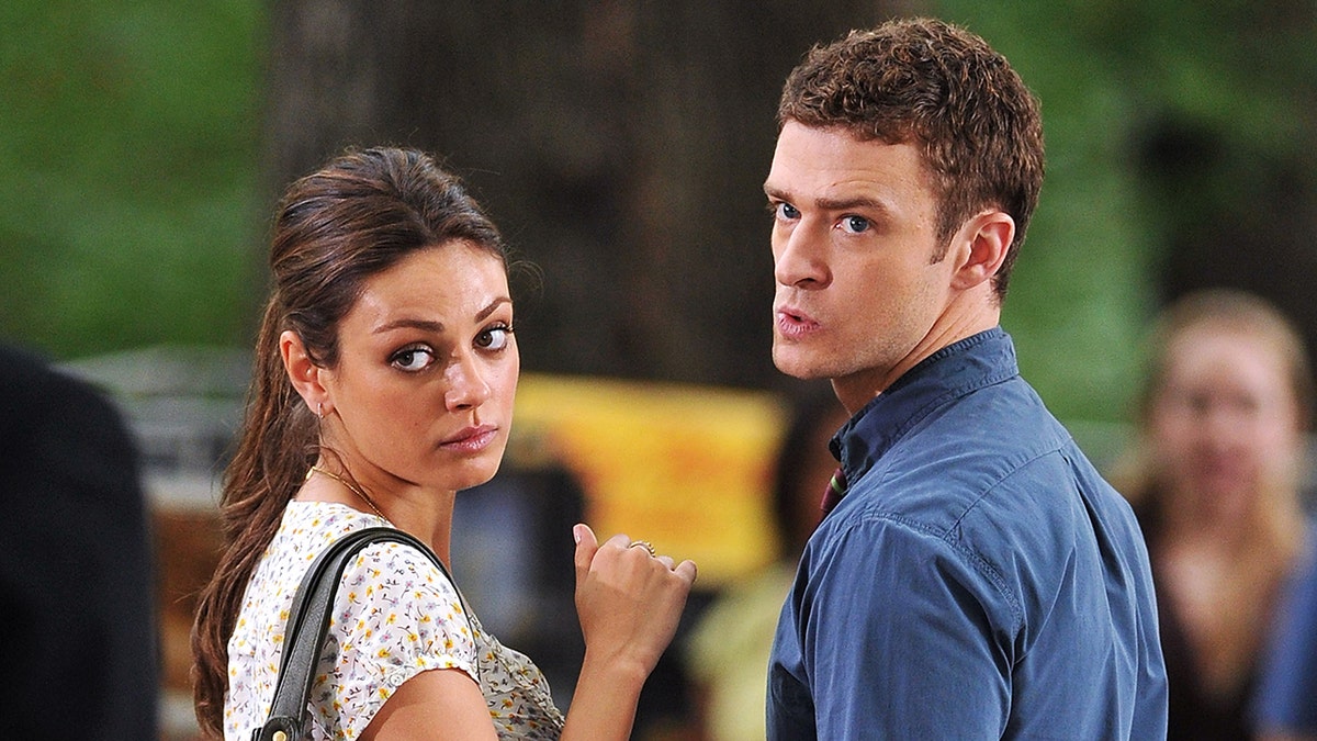 Mila Kunis and Justin Timberlake acting out a scene from the film "Friends with Benefits."