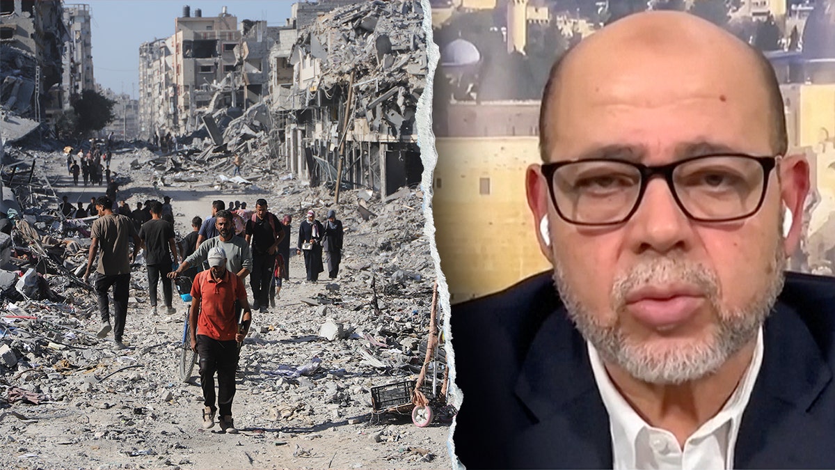 Hamas official Musa Abu Marzouk during a television interview next to scenes of destruction in Gaza City.