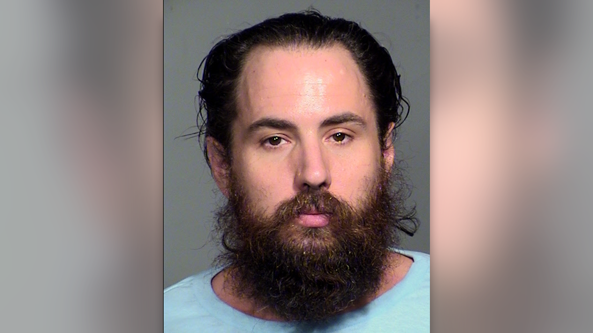 louis geri has dark hair and a long beard in this arizona mugshot