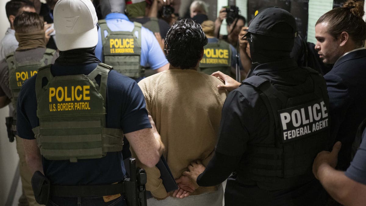 Federal agents arrest a person after going to court in an immigration court