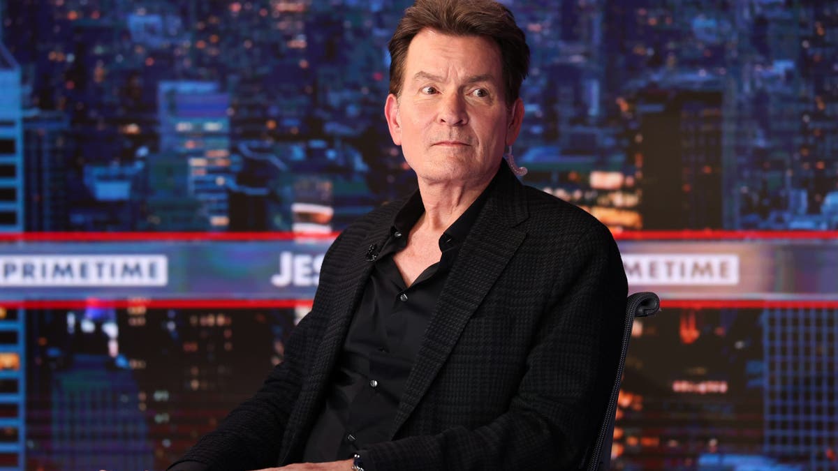 Charlie Sheen standing inside Fox News Channel Studios during Jesse Watters Primetime visit