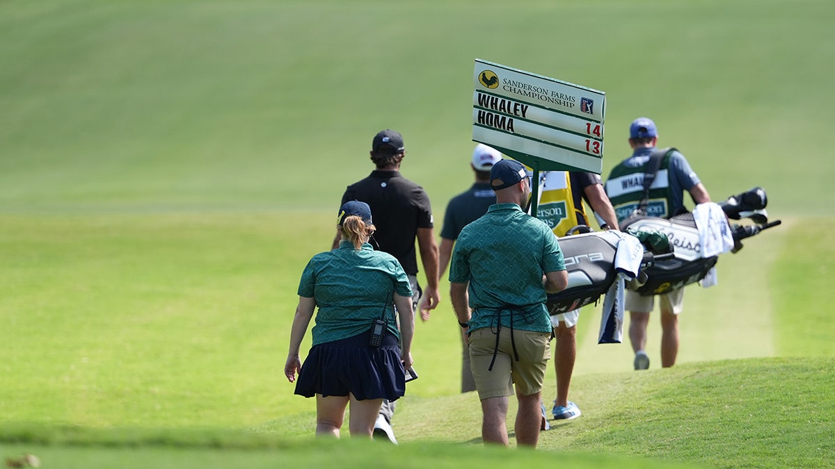 Vince Whaley and Max Homa make their way down the fairway