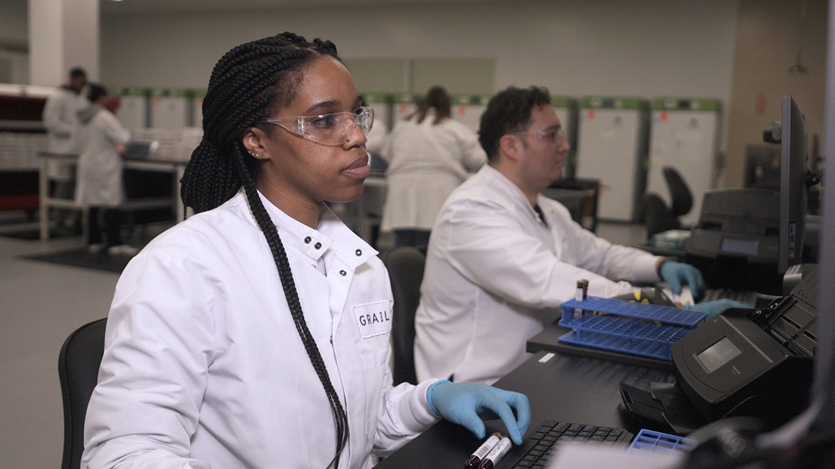 A GRAIL researcher on the computer in the lab