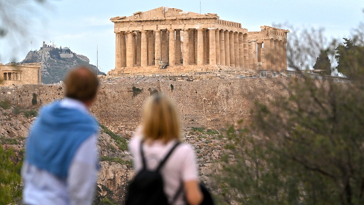 Tourists looking at Parthenon in distance