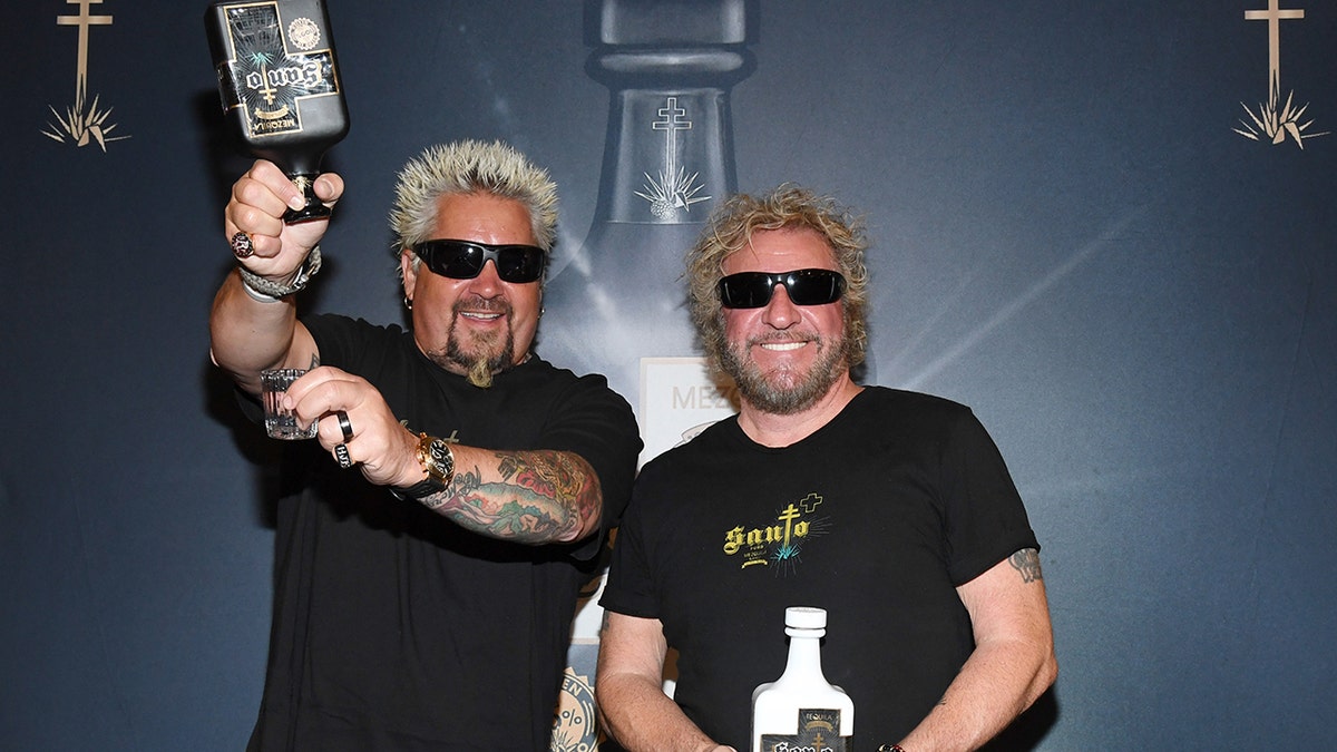 Sammy Hagar and Guy Fieri posing with their tequila in Las Vegas in April 2019.