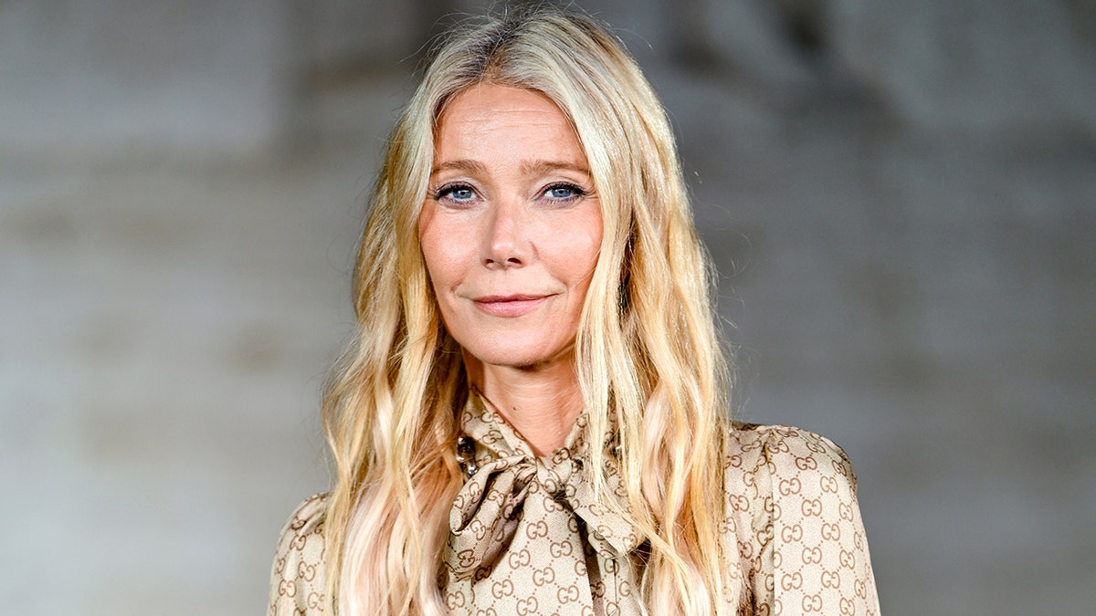 Gwyneth Paltrow smiles as she looks into the camera.