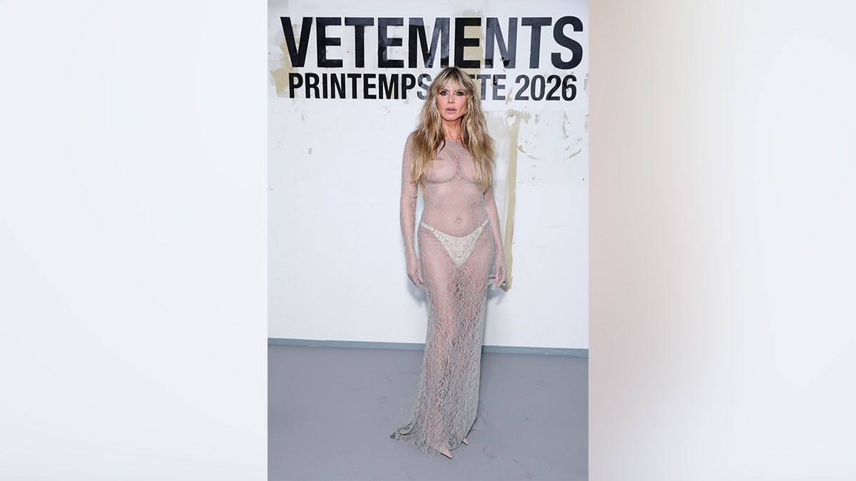 Heidi Klum in a completely sheer gown during Paris Fashion Week in October 2025