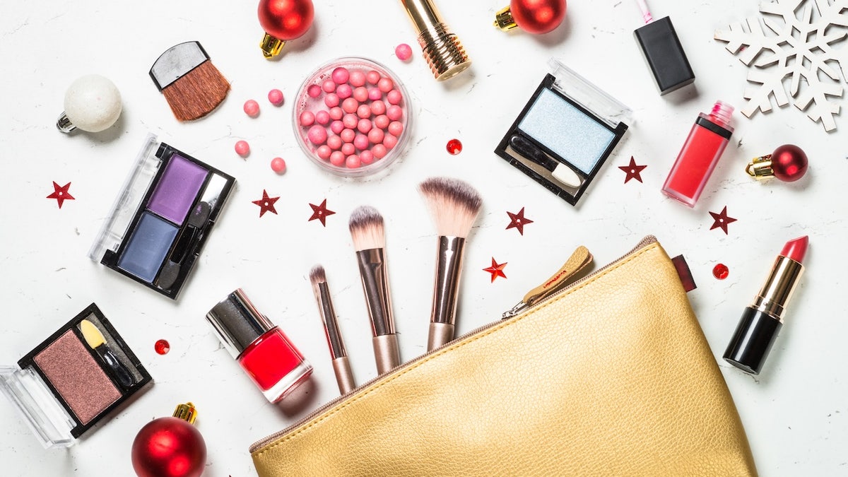 Make up products with cosmetic bag and christmas decorations