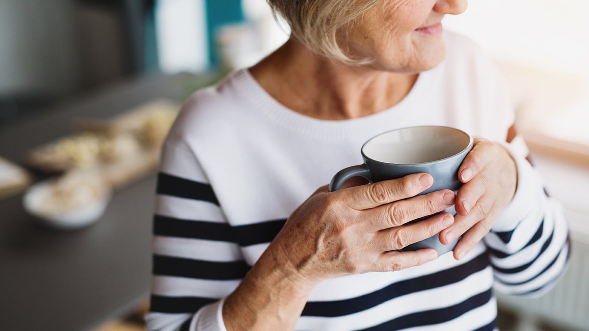 Older woman drinking coffee