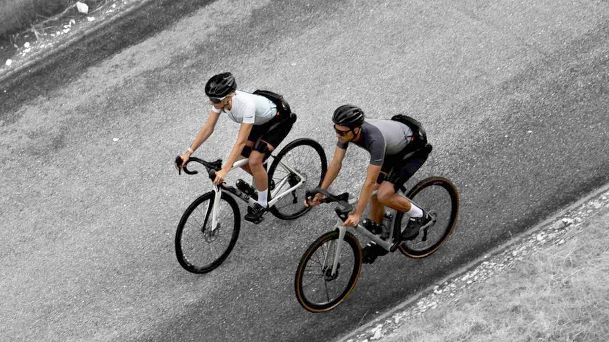 Cyclists wearing the Hypershell X Ultra exoskeleton while on a ride